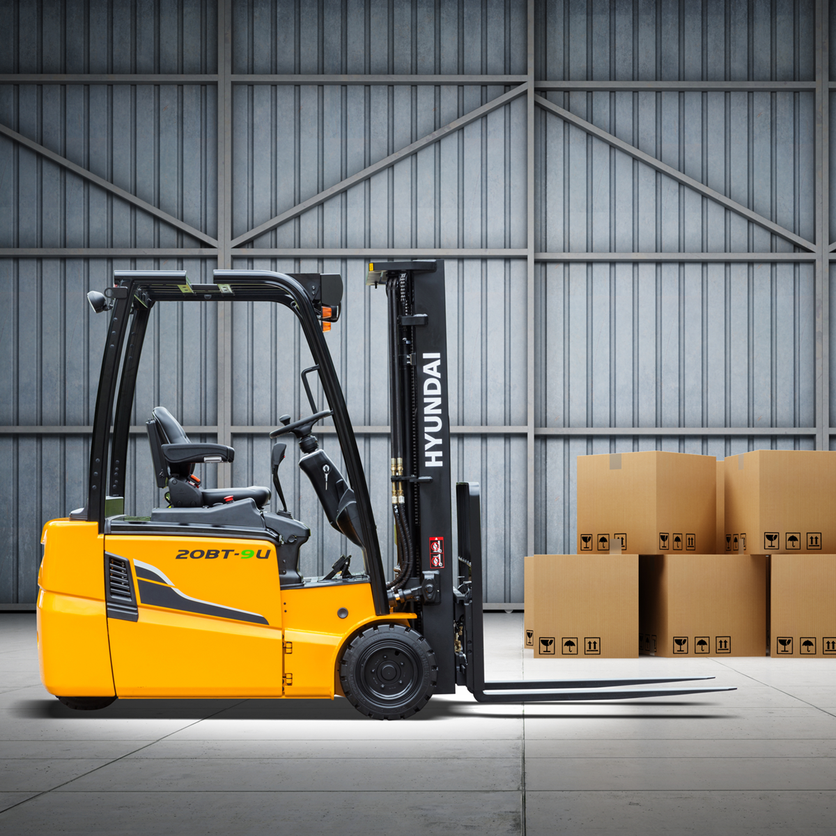 hyundai electric 20bt-9u 3 wheeled forklift in warehouse with boxes